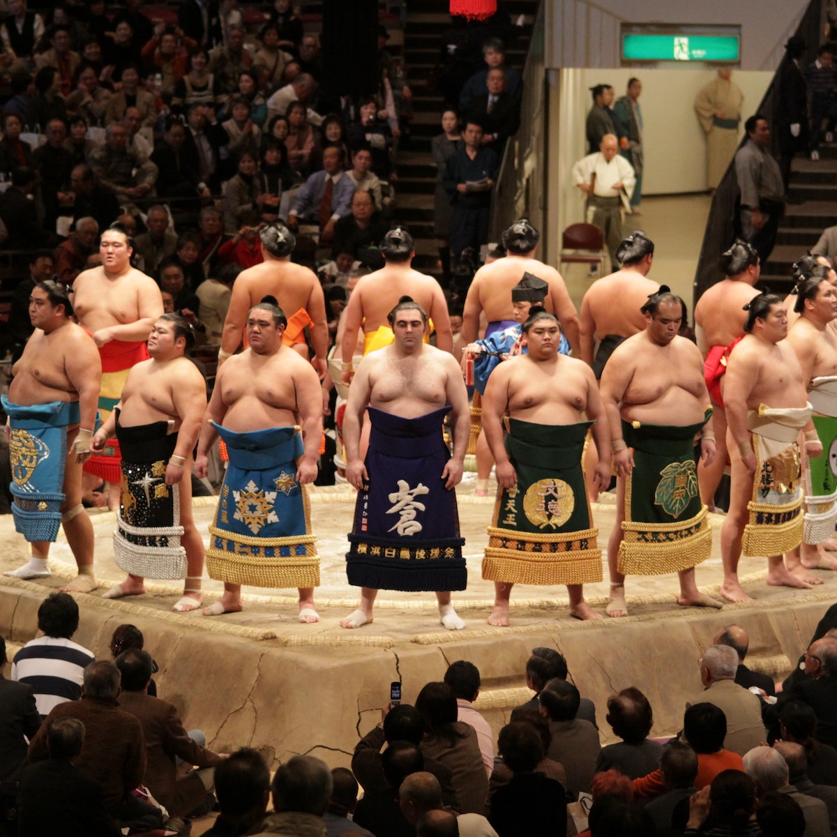 TOKYO - JANUARY 20: High rank sumo wrestlers line up with crowd in the Tokyo Grand Sumo Tournament January 20, 2009 in Tokyo, Japan.; Shutterstock ID 36619300; Your name (First / Last): Laura Crawford; GL account no.: 65050; Netsuite department name: Online Editorial; Full Product or Project name including edition: Japan page Top Experiences images