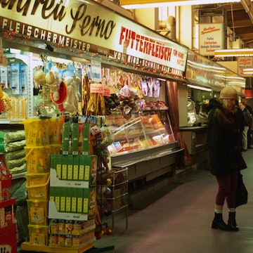 Shoppers and stalls inside Marheineke Markthalle, Marheinekeplatz.