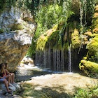 Two women looking at a little waterfall in Capelli di venere, Casaletto Spartano, Campania