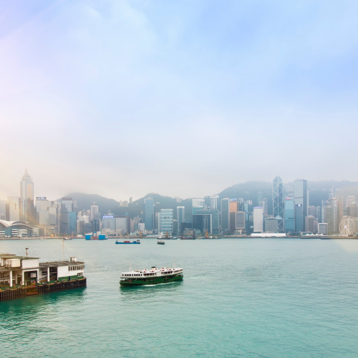 Central Hong Kong skyline and Star Ferry crossing Victoria harbor, Hong Kong, China
