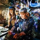 Two stylish DJs performing together late into the night at a colourful open air nightclub.
870196306
Two stylish DJs performing together at an open air nightclub in Berlin.