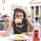Young beautiful woman having meal in front ot  Pantheon in Rome
949691978