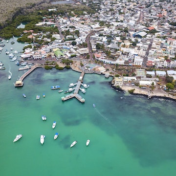 Aerial view of  the harbor and main pier Puerto Ayora, Santa Cruz Island, Galapagos. Puerto Ayora is the most populous town in the Galapagos Islands, the population is about 15000 people.