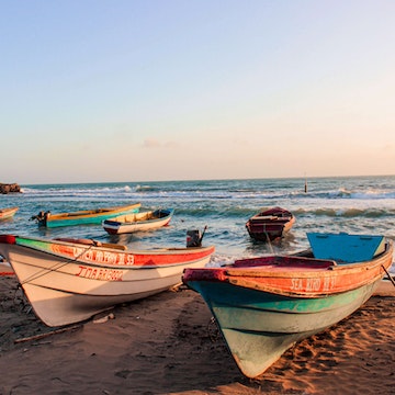Boats on the beach for sunset.