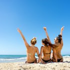 back of beautiful girls sitting at the beach; Shutterstock ID 1085571812; full: 65050; gl: Online Editorial; netsuite: Cancún on a budget; your: Bailey Freeman
1085571812