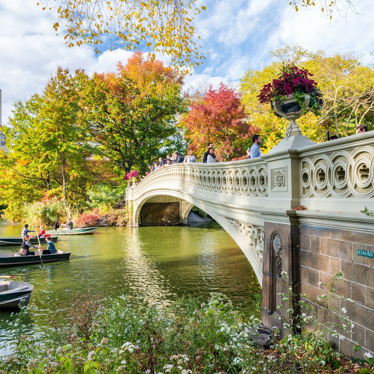 OCTOBER 2015: Visitors paddle in boats near a bridge at Central Park..