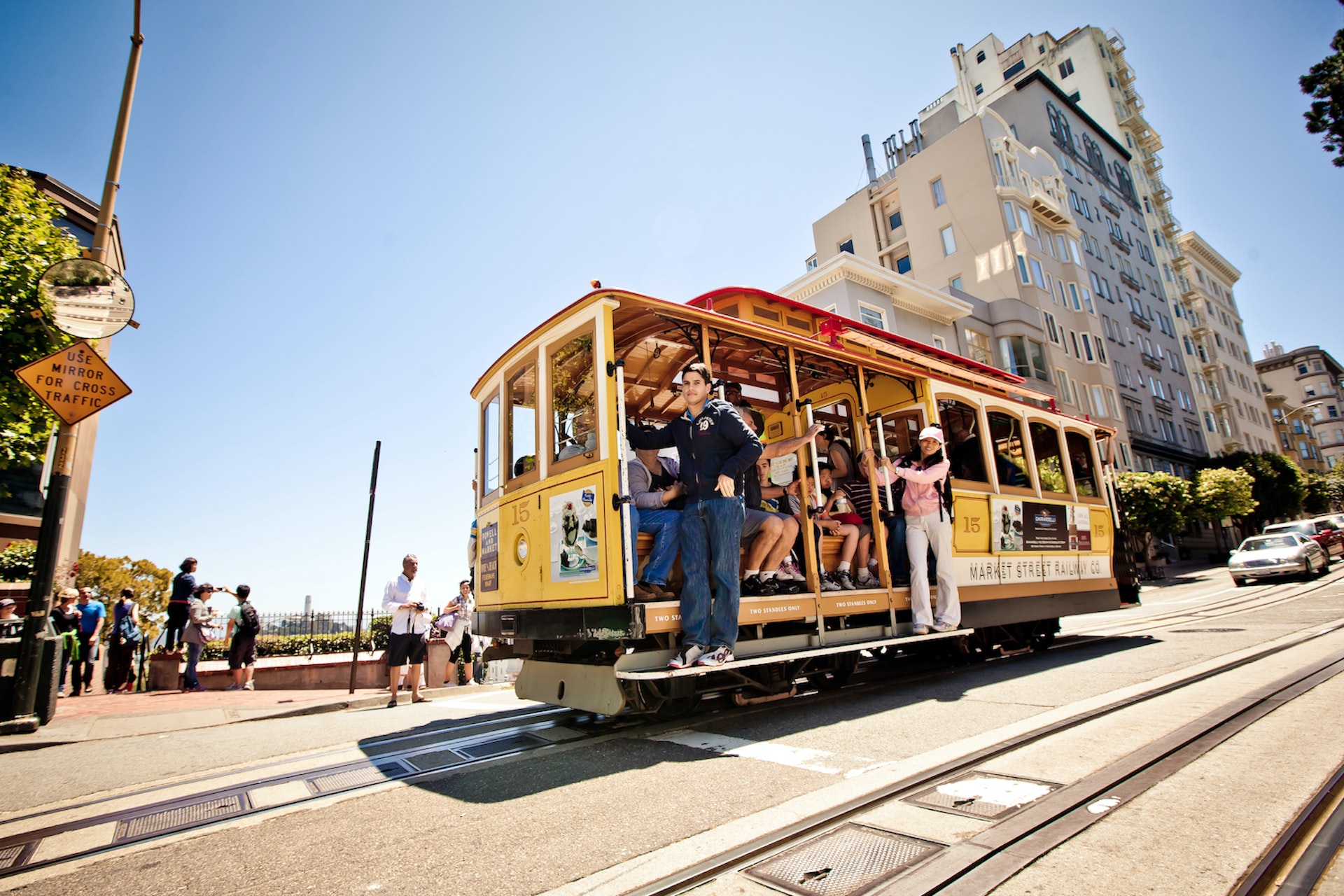 People riding on a cable car that's shooting down a hill